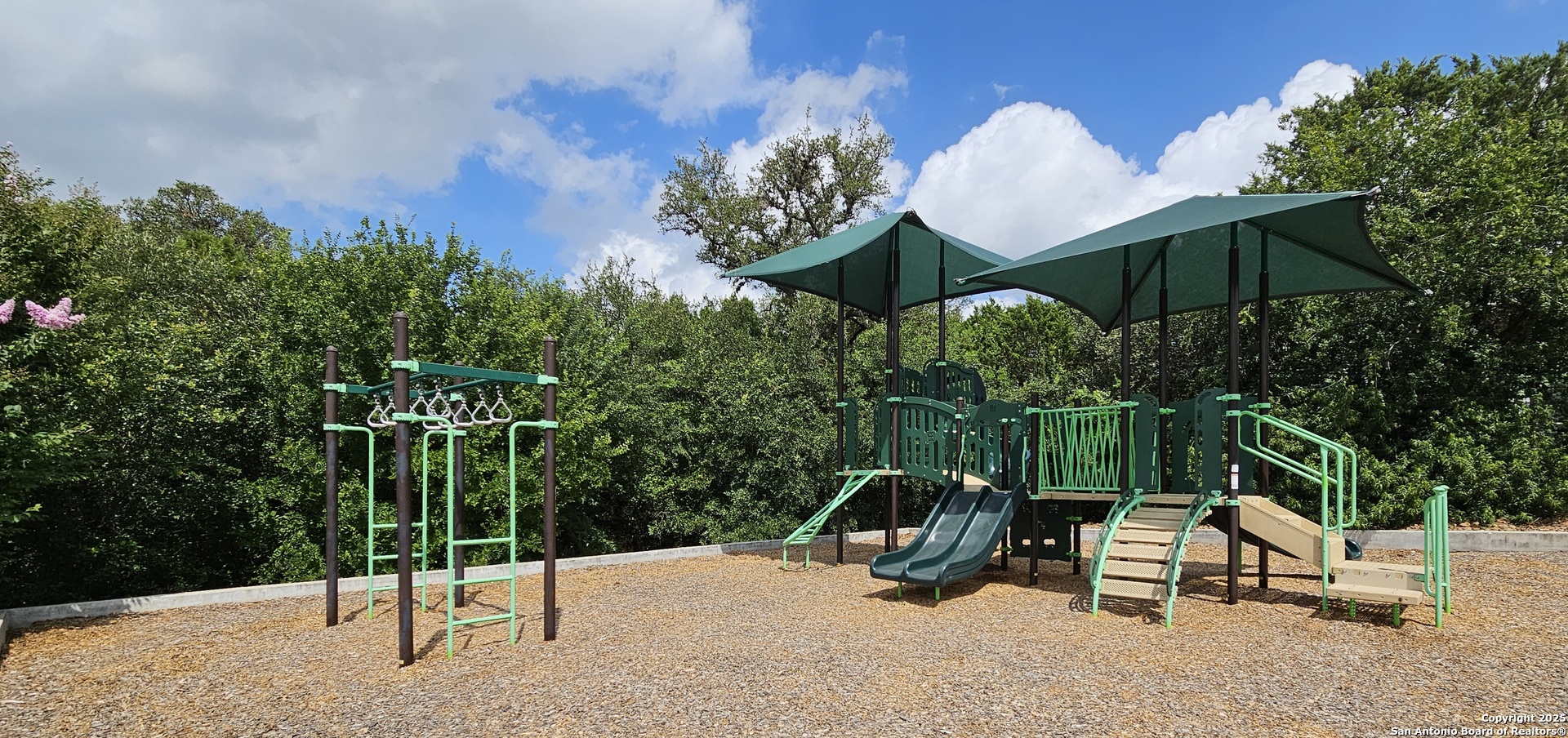 14041 Iron Horse Way Helotes, TX 78023 - Photo 43 of 49 a view of a table and chairs under an umbrella in the patio