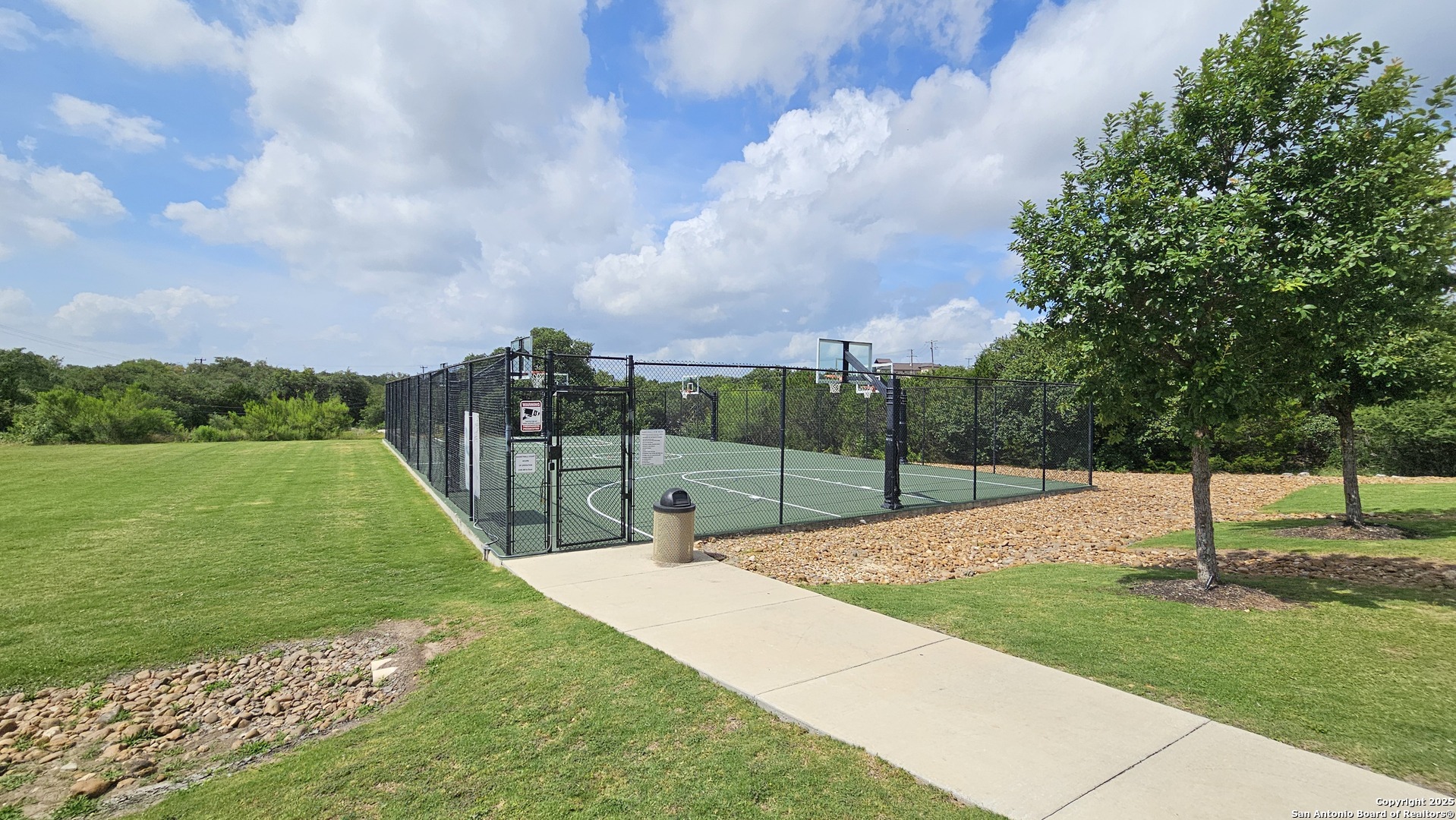 14041 Iron Horse Way Helotes, TX 78023 - Photo 44 of 49 a view of a garden with a slide