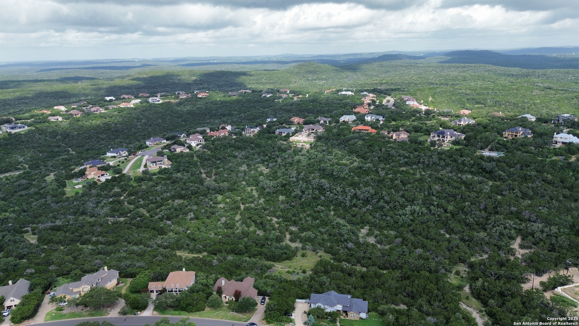 14041 Iron Horse Way Helotes, TX 78023 - Photo 46 of 49 a view of a city with lots of flowers