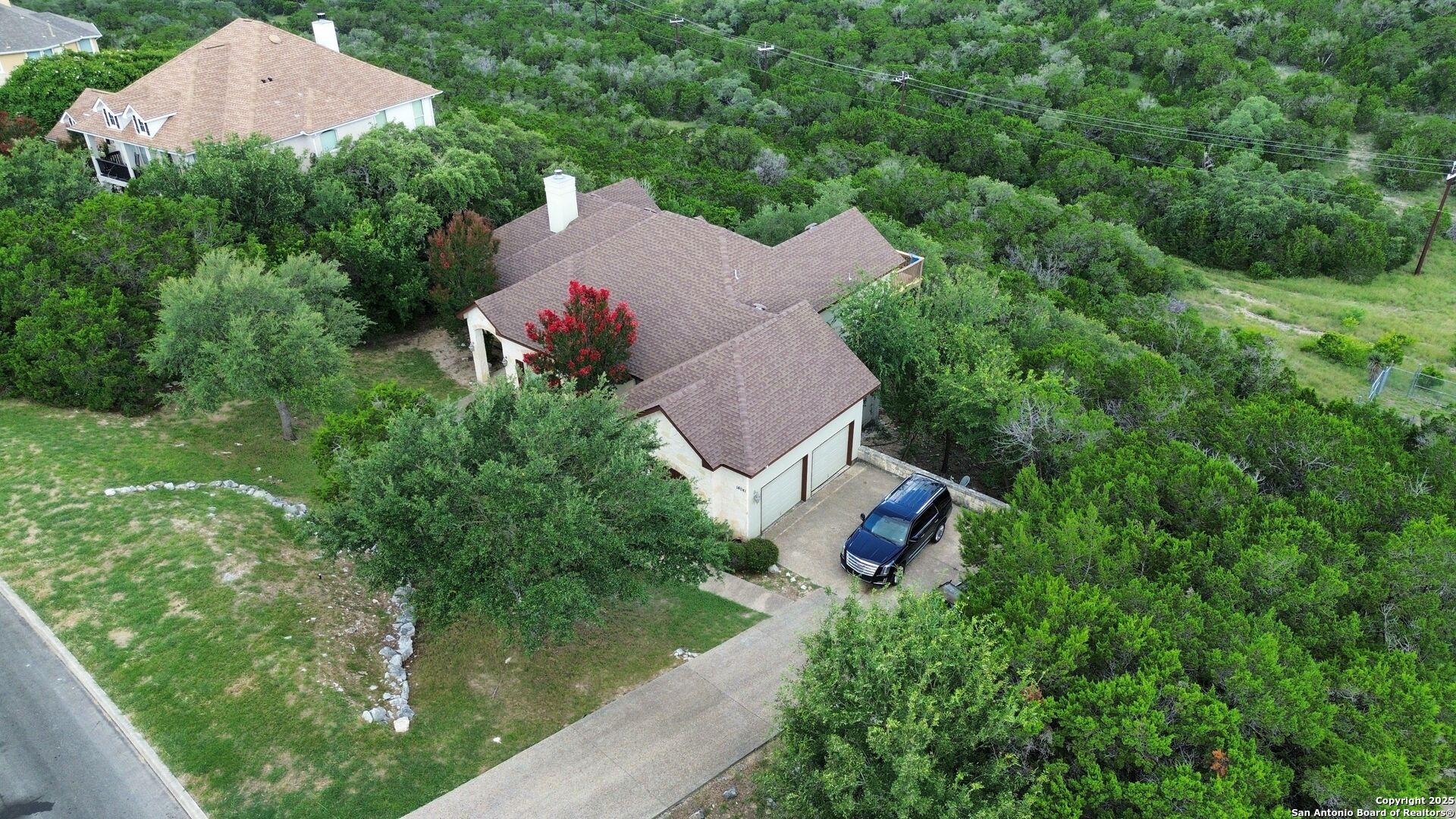 14041 Iron Horse Way Helotes, TX 78023 - Photo 47 of 49 an aerial view of house with yard swimming pool and outdoor seating