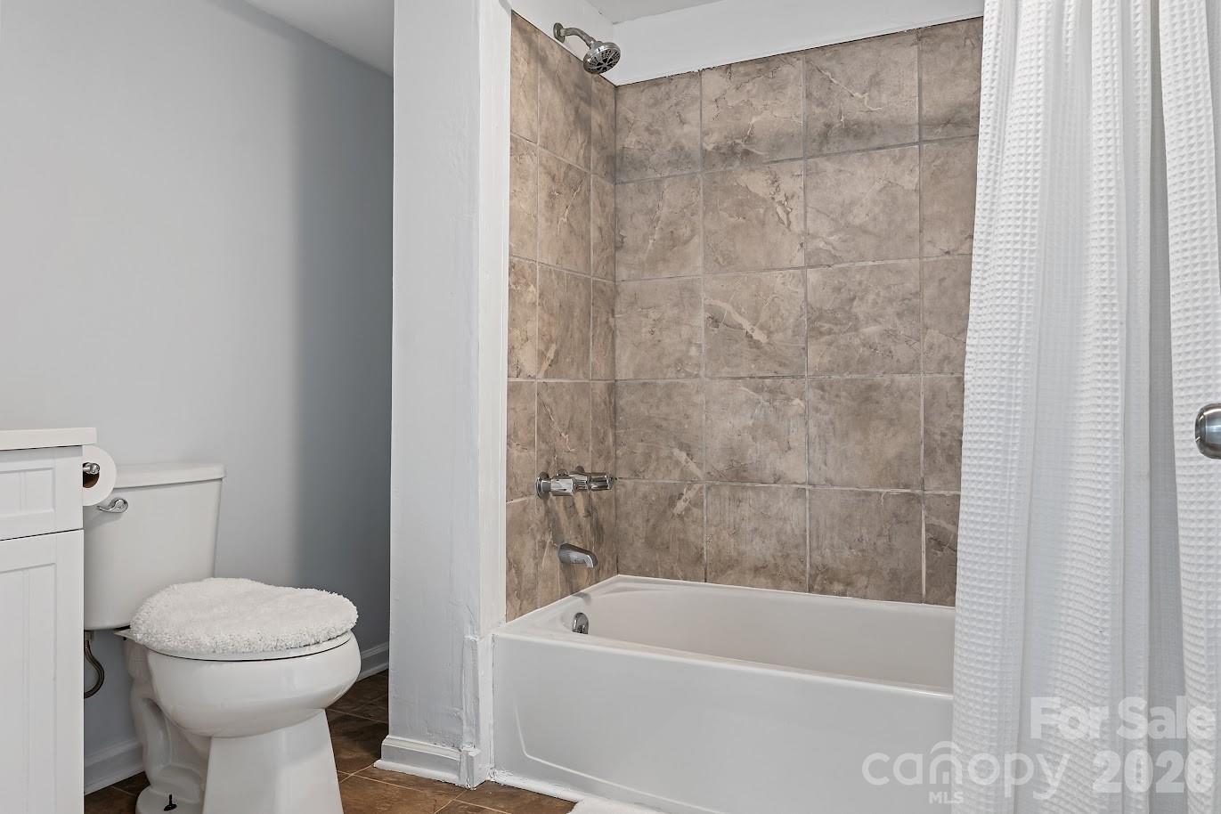 511 Stafford Street Monroe, NC 28110 - Photo 12 of 17 a bathroom with a sink a toilet and bathtub