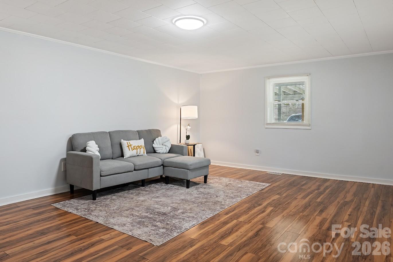 511 Stafford Street Monroe, NC 28110 - Photo 4 of 17 a living room with furniture and wooden floor