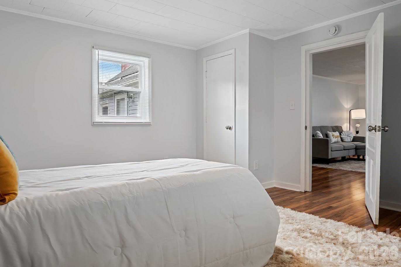 511 Stafford Street Monroe, NC 28110 - Photo 6 of 17 a bedroom with a bed and a view of kitchen