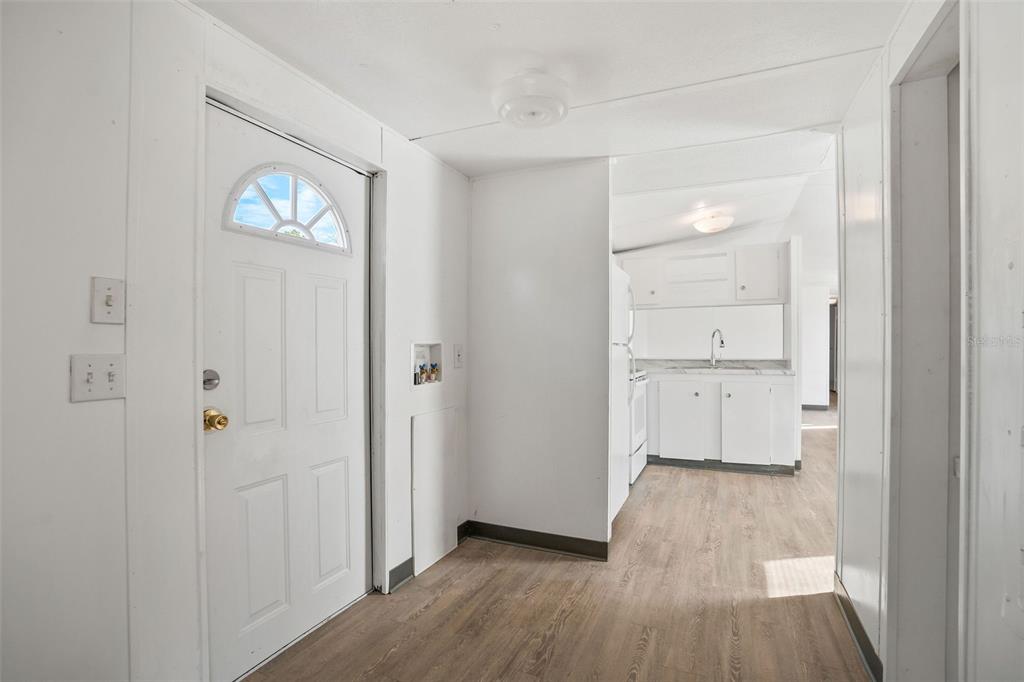9342 Labelle Street New Port Richey, FL 34654 - Photo 11 of 20 a view of a room with wooden floor closet and windows