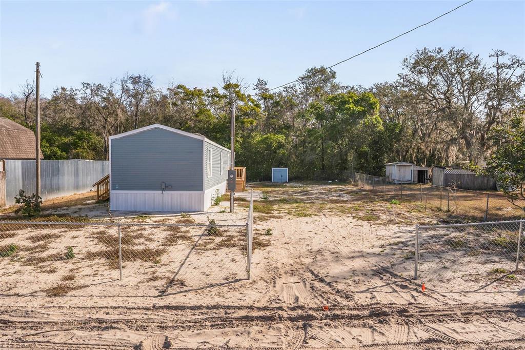 9342 Labelle Street New Port Richey, FL 34654 - Photo 15 of 20 a backyard of a house