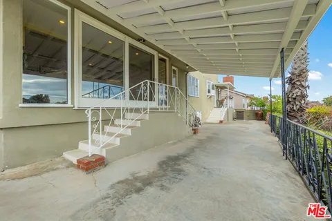 a view of a porch with sitting area