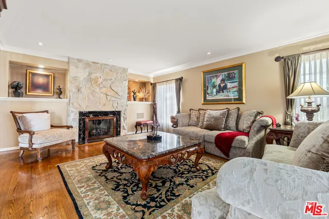 a living room with furniture and a fireplace