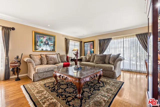 a living room with furniture and a rug