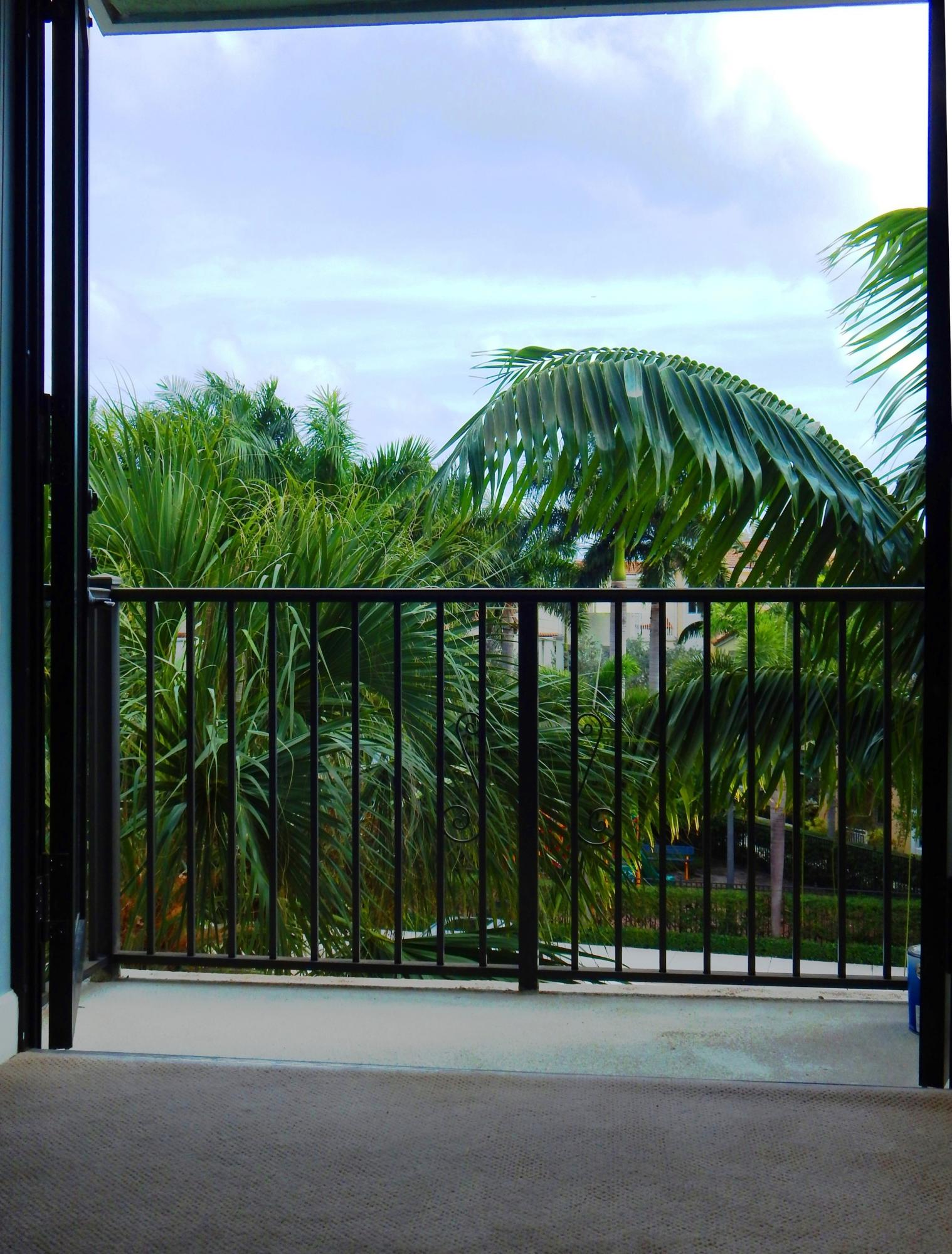 4858 Northwest 16th Avenue Boca Raton, FL 33431 - Photo 33 of 47 036_Balcony Evening and Wine
