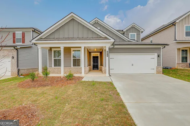 front view of a house with a yard