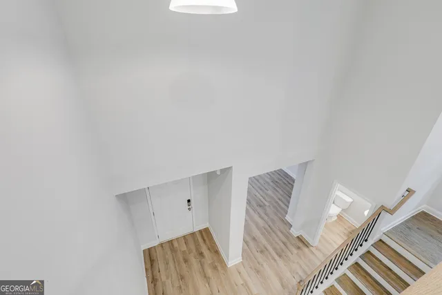 a view of bedroom with furniture and wooden floor