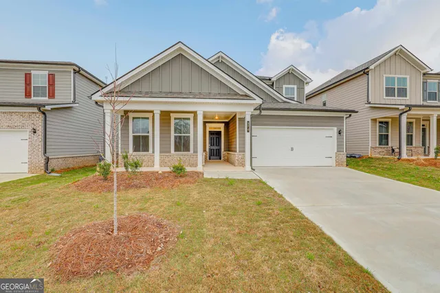 front view of a house with a yard