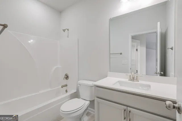 a bathroom with a sink a toilet and a bathtub