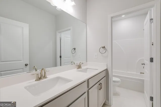 an empty room with a window and a ceiling fan