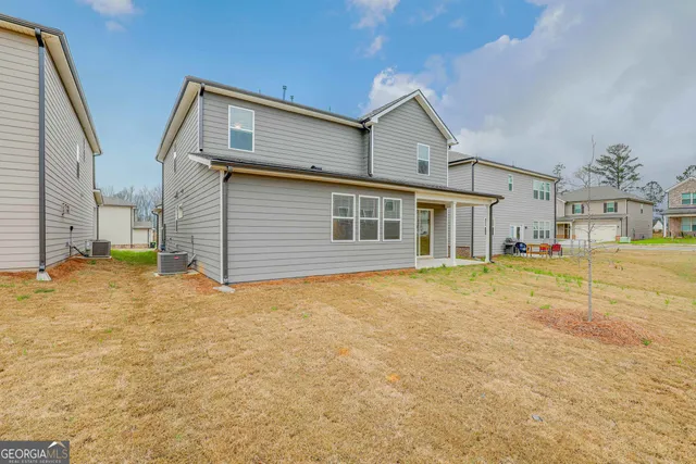a front view of a house with a outdoor space