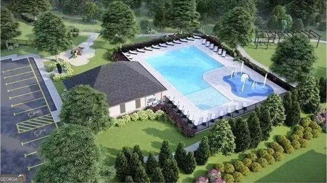 an aerial view of residential houses with outdoor space and swimming pool