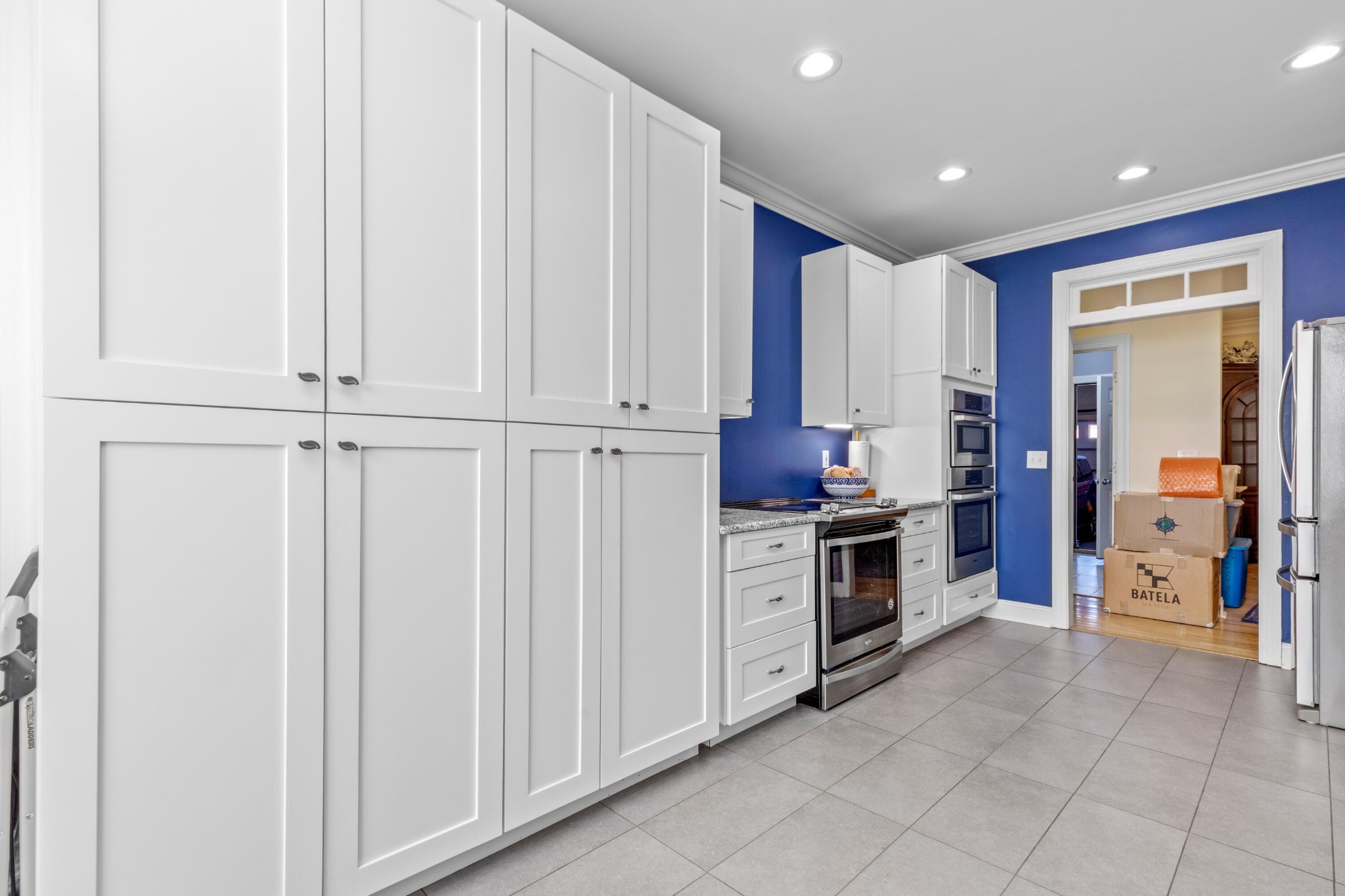 59 Honeysuckle Drive Rock Spring, GA 30739 - Photo 14 of 63 a kitchen with granite countertop white cabinets and stainless steel appliances