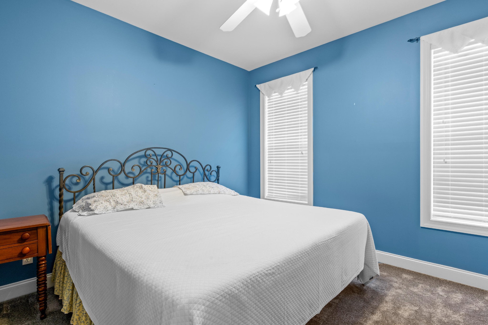 59 Honeysuckle Drive Rock Spring, GA 30739 - Photo 19 of 63 a bedroom with a bed and a chandelier