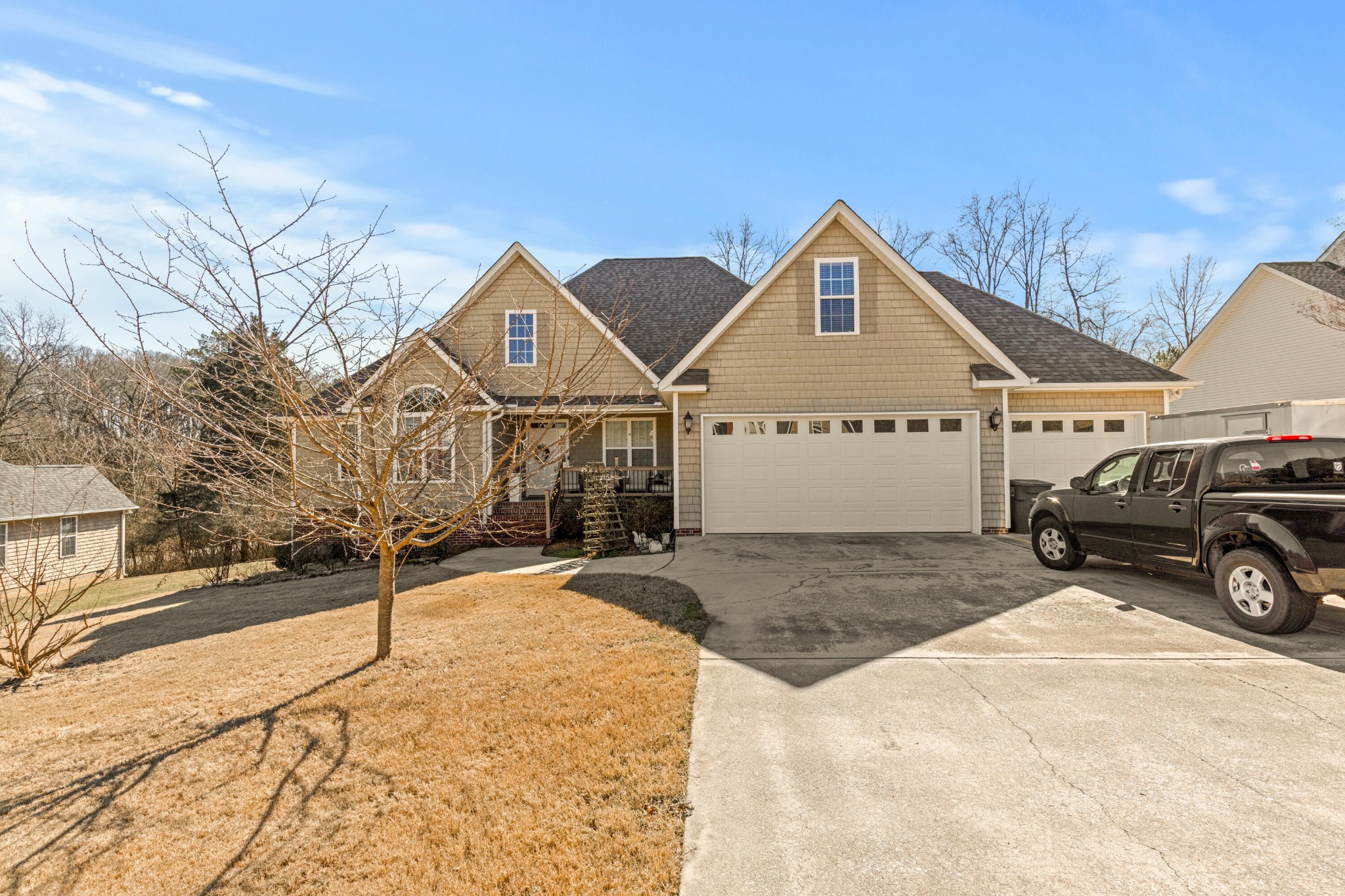 59 Honeysuckle Drive Rock Spring, GA 30739 - Photo 5 of 63 a view of a house with snow on the road