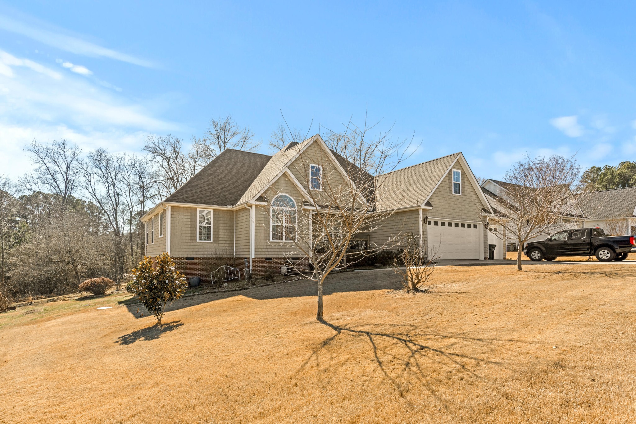 59 Honeysuckle Drive Rock Spring, GA 30739 - Photo 6 of 63 a front view of a house with a yard covered in snow