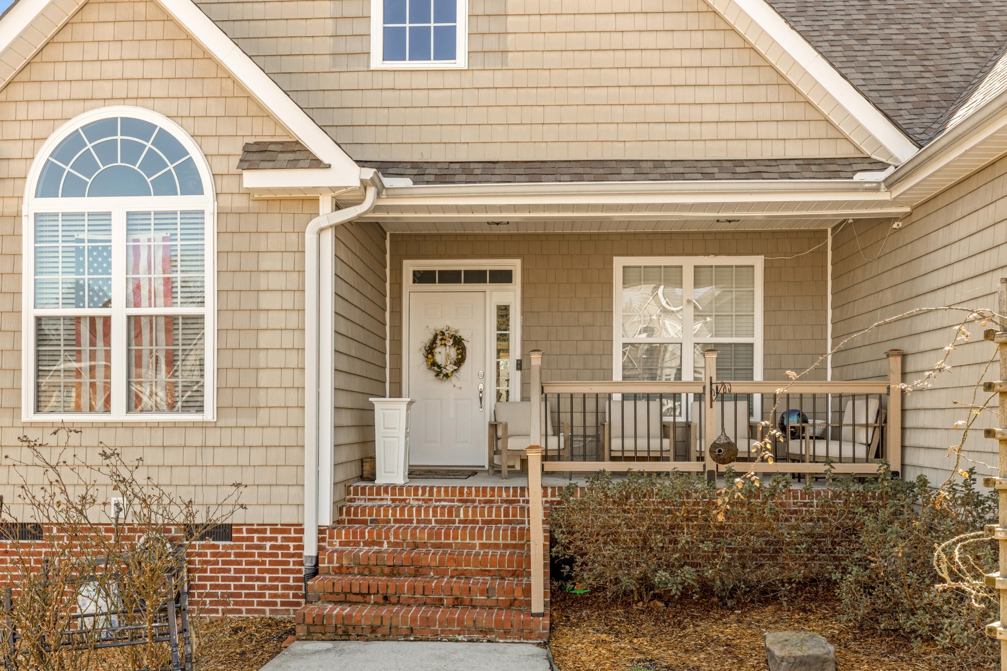 59 Honeysuckle Drive Rock Spring, GA 30739 - Photo 7 of 63 a view of a brick house with many windows