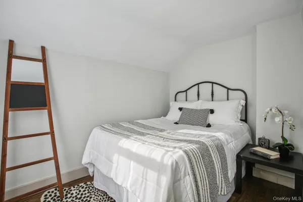 a bedroom with a bed and cabinets