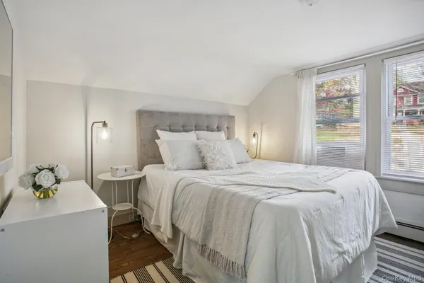 a bedroom with a bed and window