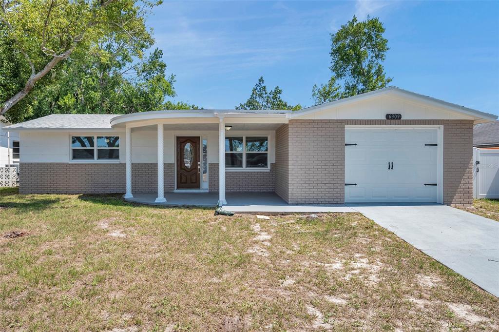 front view of a house with a yard