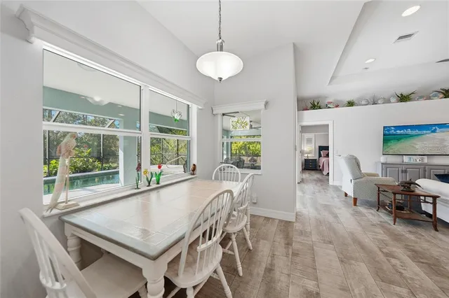 a view of a dining room with furniture window and outside view