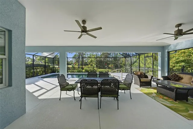 a dining room with furniture and wooden floor