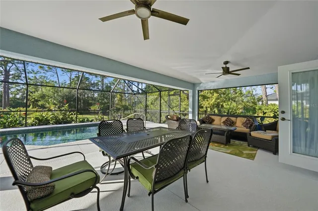 a view of a swimming pool with a patio