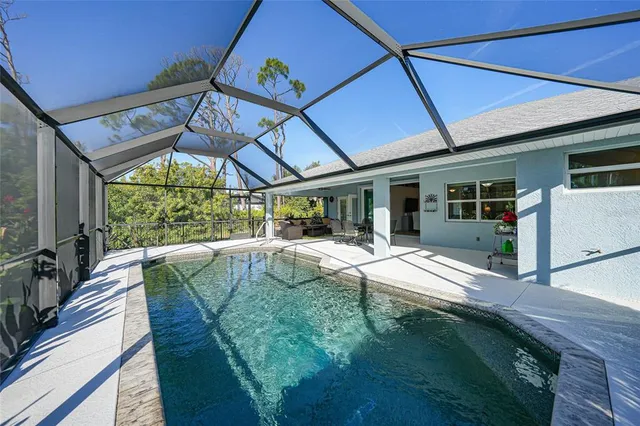 a view of swimming pool with a balcony