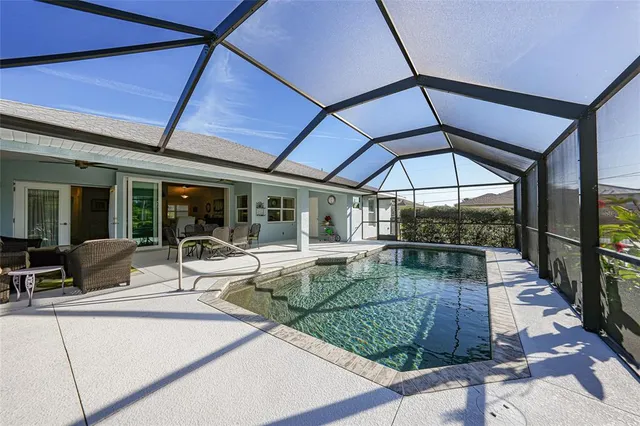 a house with a flower garden and potted plants