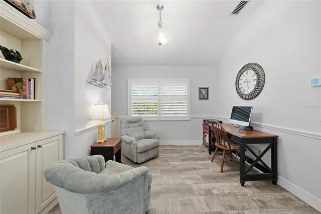 a workspace with furniture and a window