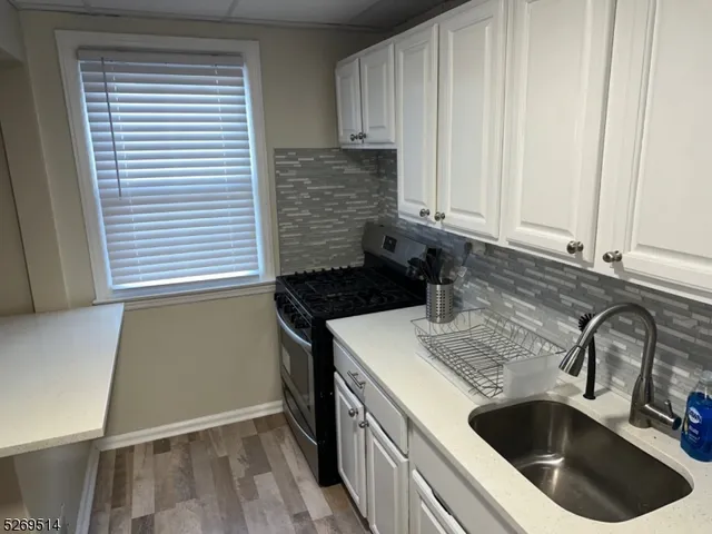 a kitchen with a sink and cabinets