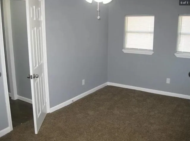 an empty room with windows