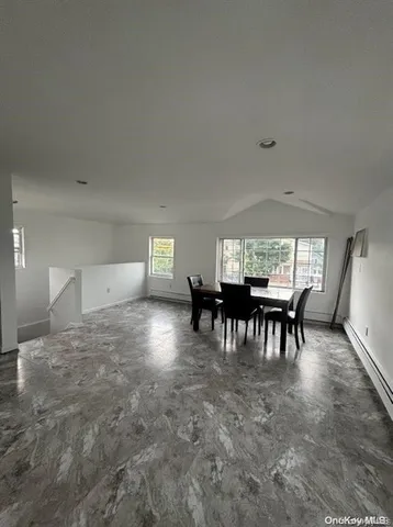 a view of a livingroom with furniture and chandelier