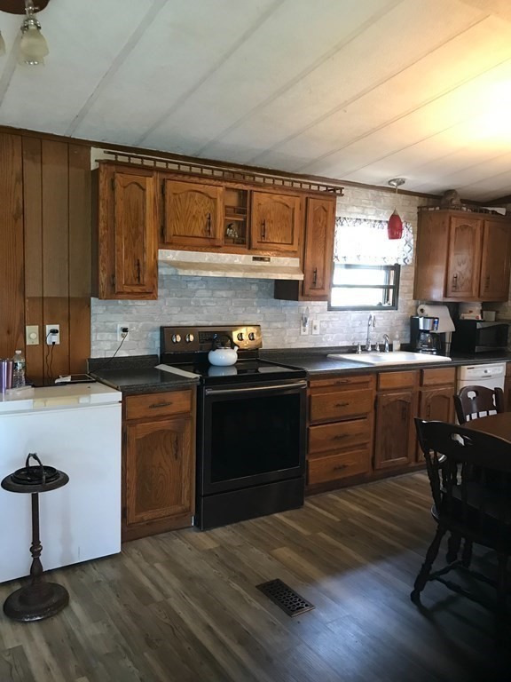48 Gould Road Ware, MA 01082 - Photo 17 of 37 a kitchen with granite countertop wooden floors appliances and sink