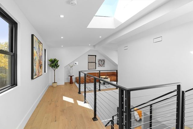 a view of a livingroom with furniture and wooden floor
