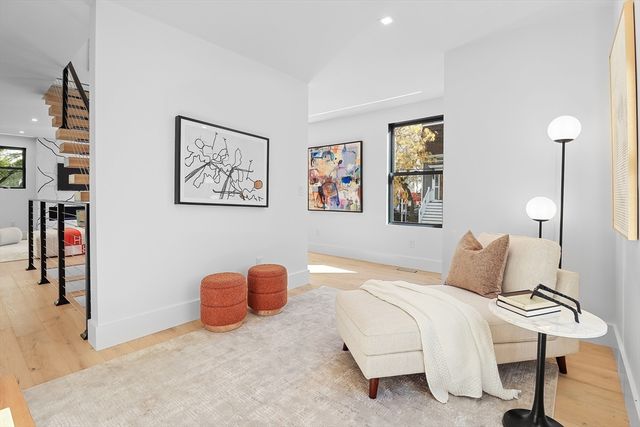 a bedroom with furniture and wooden floor