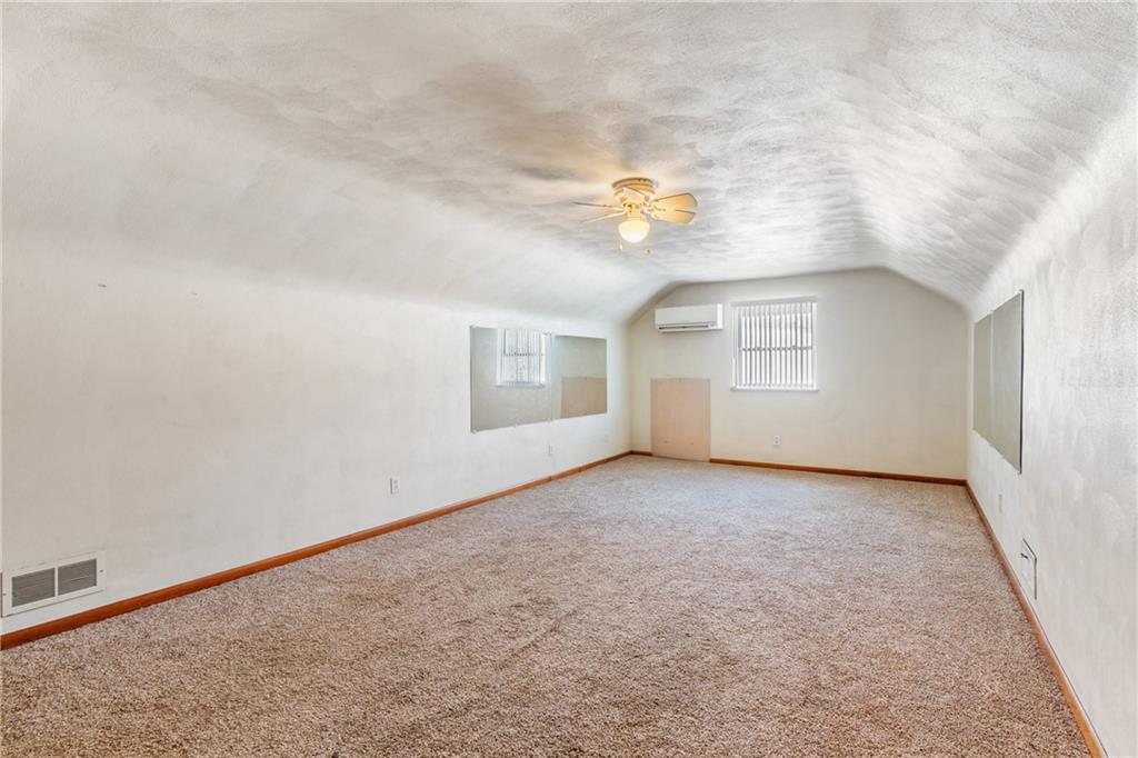 316 Noll Road Georgetown, PA 15043 - Photo 23 of 48 an empty room with windows & cabinet