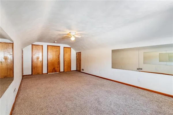 an empty room with a bathroom