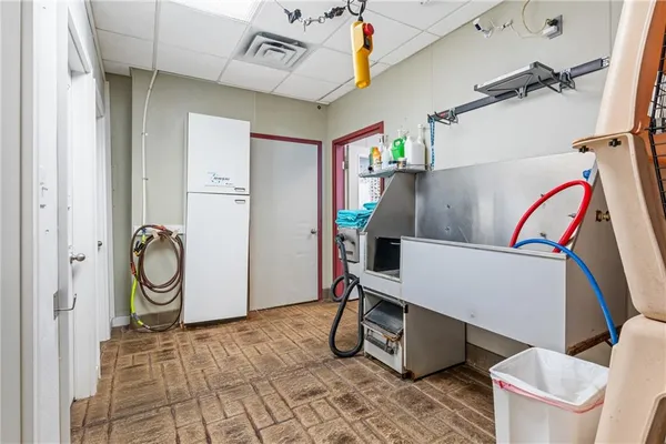 a view of a bathroom with a shower and a sink