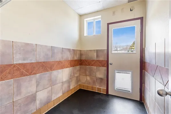 a view of a yard with plants and outdoor seating