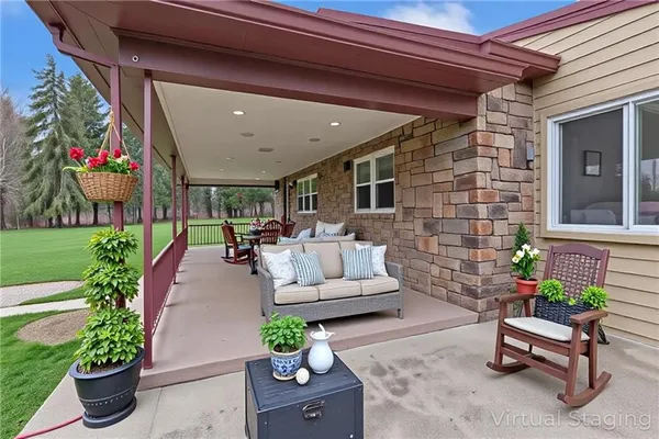a lobby with furniture and potted plants