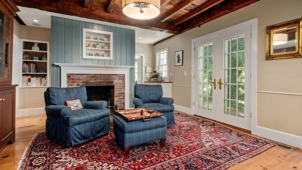 49 Salem Street Andover, MA 01810 - Photo 12 of 39 a living room with furniture and a fireplace