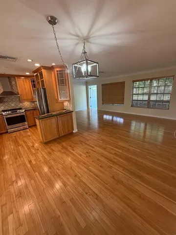 a view of a livingroom with wooden floor