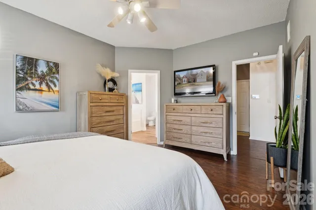 a bedroom with a bed and a dresser