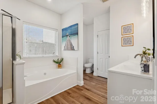 a bathroom with a bathtub sink and toilet