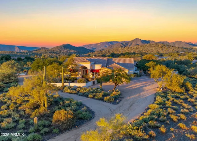 an aerial view of residential houses and outdoor space